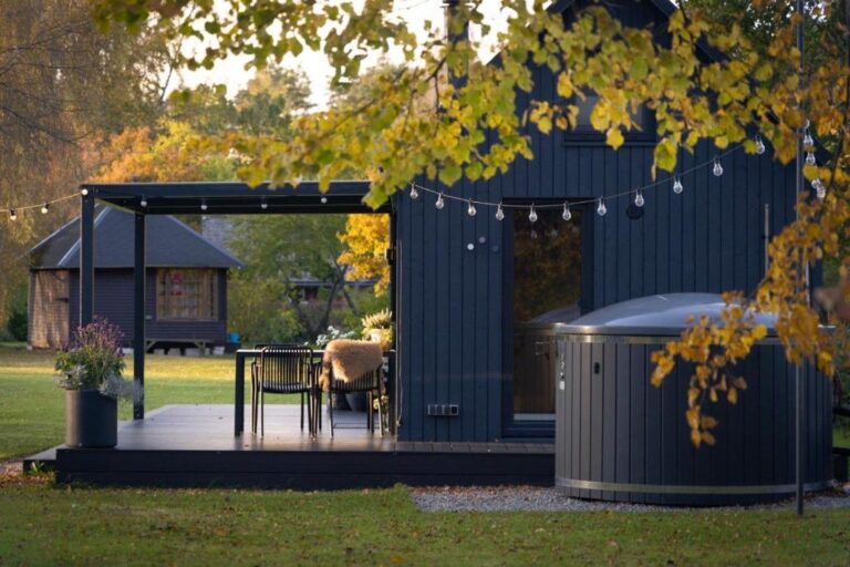 MyCabin modular home with a covered terrace and outdoor hot tub